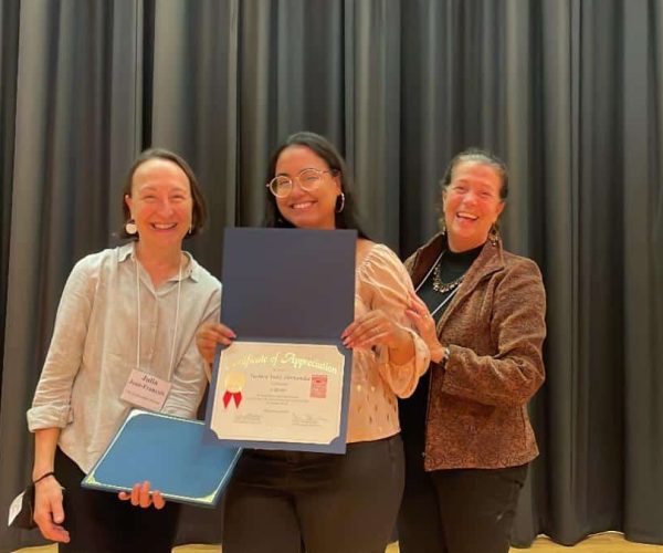 Tashira Velez Hernandez receiving her award for 5 years with CFLSP, presented by Co-Executive Directors Julia Jean-Francois and Julie Stein Brockway!