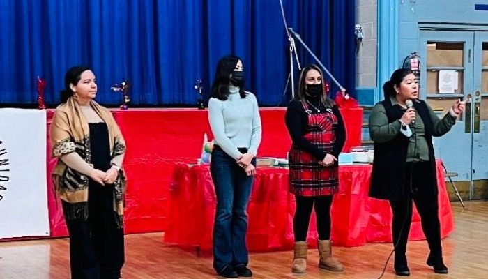 UCC worker-owners speaking at an event at Our Lady of Perpetual Help UCC worker-owners speaking at an event at Our Lady of Perpetual Help